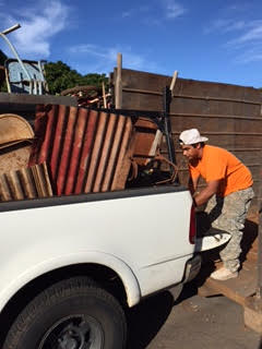 Hoku Acantilado prepares to unload his scrap metal. Photo provided by Lahaina Sunset Rotary.