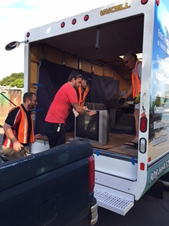 Rotary volunteers help Alexander Pike drop off e-recyclables. Photo provided by Lahaina Sunset Rotary.