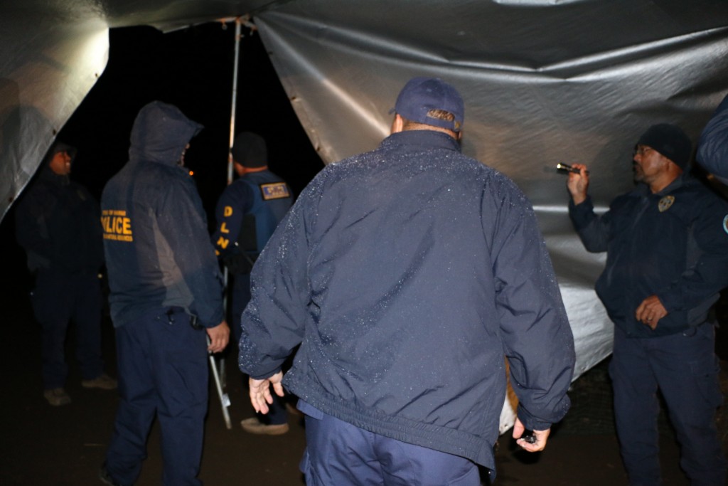 DOCARE officers disassembed, loaded and took as evidence, a large tent that protesters had erected at the 9000 foot elevation level, across the road from the Mauna Kea Visitors Center. Photo credit: DLNR.