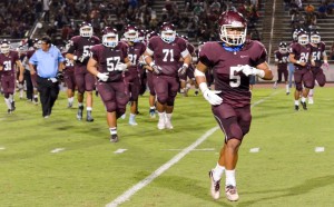 Baldwin's defensive captain Kawena Alo-Kaonohi (5) leads the Bears to the locker room at halftime Friday. Photo by Rodney S. Yap.