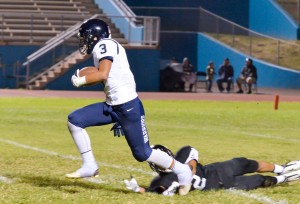Kamehameha Maui's Ekolu Watanabe fields this punt and looks for running room. Photo by Rodney S. Yap.