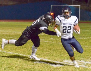 Kamehameha Maui's Covy Cremer (22) gets around a King Kekaulike would-be tackler Saturday. Photo by Rodney S. Yap.