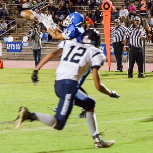 Maui High's Edmund Foronda (83) catches this touchdown pass in front of Kamehameha Maui's Kahai Bustillos. Photo by Rodney S. Yap.
