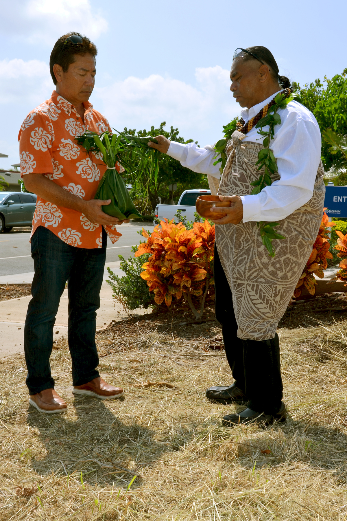 Mark Teruya, chairman and CEO of Armstrong Produce, holds a ho`okupu during the groundbreaking ceremony for construction of Kula Produce’s new facility in Maui Lani. Kahu Marcelo Bustillos officiated the private groundbreaking event on October 9. Photo courtesy of Maui Lani Village Center.