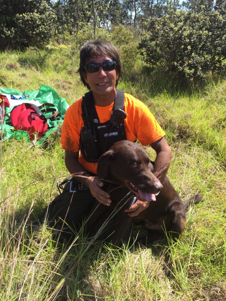 NPS Photo/Park Ranger Arnold Nakata and rescued dog, Romeo. Photo credit: Hawai‘i Volcanoes National Park.