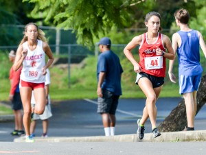 Iolani's Amanda Beamon takes over the lead from Seabury Hall's Ava Shipman during the second loop of the three-mile race at Seabury Hall. Photo by Rodney S. Yap.