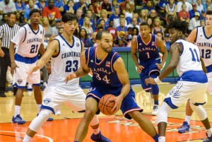 Kansas' Perry Ellis works the low-post against Chaminade's Kevin Hu (23) and David Ware (11). Ellis scored 11 points Monday. Photo by Rodney S. Yap.