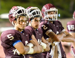 From left, Baldwin's Kawena Alo-Kaonohi, Aloalii Laga, and Chayce Akaka pose for a photo during a break late in their game with Maui High last week. Photo by Rodney S. Yap.