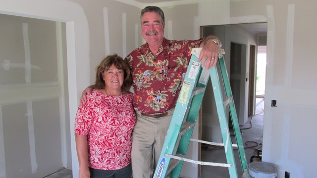 Sandra Duvauchelle (left) is the general contractor who is building the prototype Na Hale O Maui affordable home on Kama Street in Waikapu. With her is John Andersen, executive director of the NHOM Community Land Trust, Andersen has placed 30 families in homes that will remain affordable in perpetuity and never go to market price. Courtesy photo.