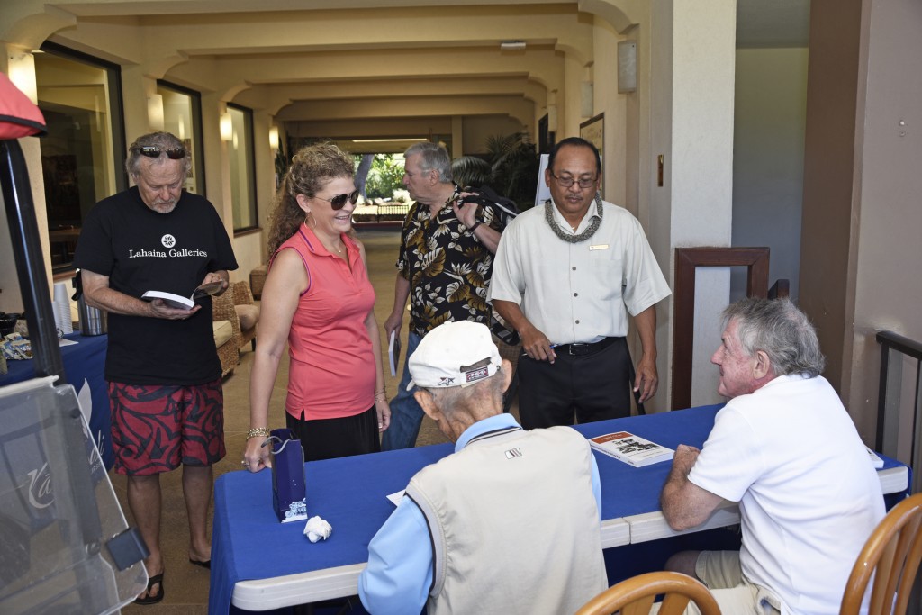 Tommy Sarashina signing copies of the book. Image courtesy: Kāʻanapali Golf Courses.