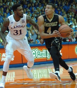 Vanderbilt's Wade Baldwin drives to the basket against Kansas' defender Jamari Traylor (31). Photo by Joel B. Tamayo.