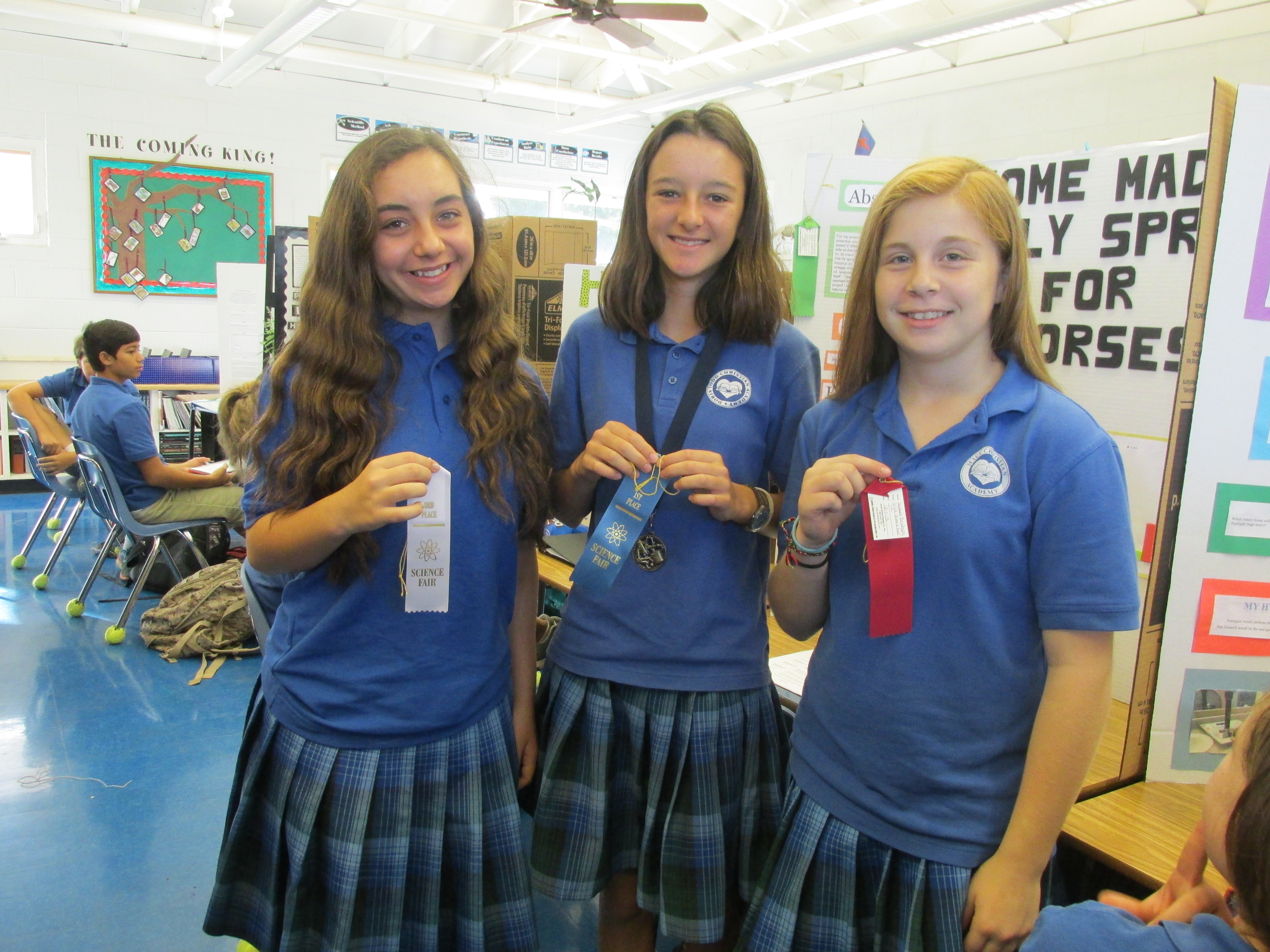 Doris Todd Science Fair seventh grade winners (left to right): Natalie Boody, second place; Keala Bouwens, first place and grand champion; and Stephanie Reisdorph, third place.