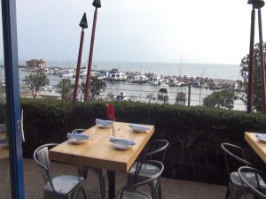 Outdoor dining with ocean views at Oceanside. Photo by Kiaora Bohlool.