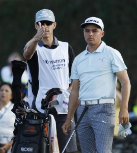 PGA golfer Rickie Fowler talks to his caddie before teeing off on the first hole during the third round of the Hyundai Tournament of Champions golf tournament at Kapalua Resort on Saturday. Photo by Brian Spurlock of USA TODAY Sports.