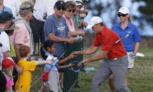 PGA golfer Jordan Spieth signs autographs on his way to the first tee during the third round of the Hyundai Tournament of Champions golf tournament at Kapalua Resort on Saturday. -Photo by Brian Spurlock of USA TODAY Sports.