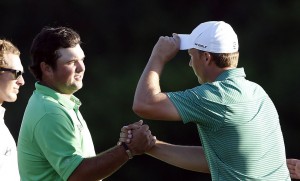 PGA golfer Patrick Reed (left) shakes hands with Jordan Spieth after finishing on the 18th green during the first round of the Hyundai Tournament of Champions golf tournament at Kapalua Resort on Thursday. Photo by Brian Spurlock of USA TODAY Sports.