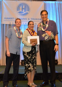 (Left to right) Ben Rafter, HLTA chairperson); Emily Arcangel, 2016 Outstanding Lodging Employee of the Year; and Mufi Hannemann, HLTA president and CEO. HLTA photo.