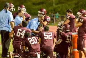 Former Baldwin defensive coordinator Jack Damuni talks to the defense during a time out last season at War Memorial Stadium. File photo by Rodney S. Yap.