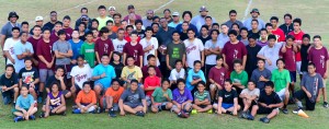 The Wailuku Big Boyz players and coaches pose with Jack Damuni (middle) on his last day of practice, Feb. 5, at the Pit Field. Photo by Rodney S. Yap.