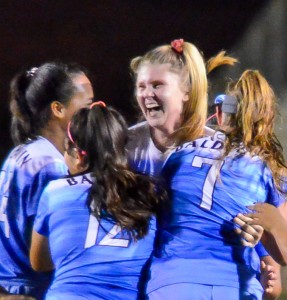 Baldwin's Skylar Littlefield is mobbed by her teammates Friday after scoring the game's only goal in the 78th minute. Photo by Rodney S. Yap.