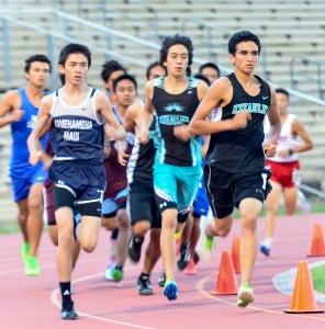 King Kekaulike's Dalton Aganos (right) leads the field at the start of the first lap in the boys 1500. Photo by Rodney S. Yap.