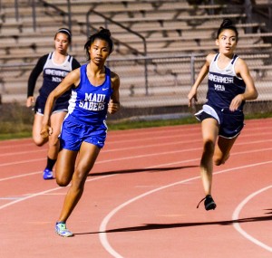 Maui High's Alyssa Mae Antolin and Kamehameha Maui's Ani Nitta finished 1-2 in their heat of the girls 200 Friday. Antolin's time of 26.01 was the fastest in the girls division. Photo by Rodney S. Yap.