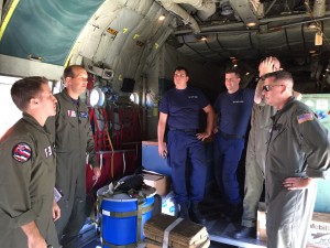 A Coast Guard HC-130 Hercules airplane crew conducts a pre-flight brief prior to launching from Air Station Barbers Point in response to a report of 40 people abandoning ship south of the Hawaiian Islands, Feb. 10, 2016. (U.S. Coast Guard photo by Lt. Sarah Bradley)