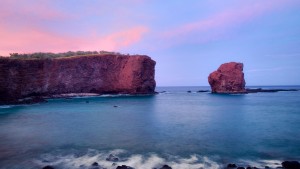 Puʻu Pehe, or Sweetheart Rock, at sunset on Lānaʻi.  Photo courtesy of Four Seasons Resort Lānaʻi.