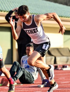 A Kihei Charter runner explodes out of the starting blocks in the boys 100-meter dash. Photo by Rodney S. Yap.