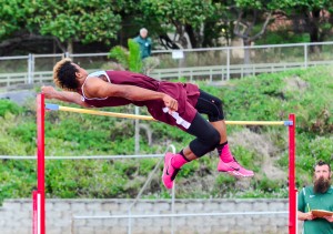 Baldwin's La'akea Kahoohanohano-Davis clears the high jump cross bar at 6 feet 6 3/4 inches on his first try Saturday. The winning height was a new meet record. Photo by Rodney S. Yap.