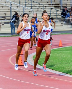 Seabury Hall's Ava Shipman leads teammate Veronica Winham in the girls 800 Saturday at the Yamamoto Track & Field Facility. Photo by Rodney S. Yap.