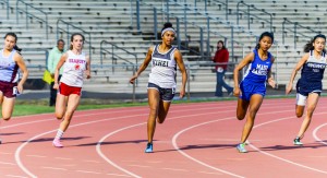 Kihei Charter's Maya Reynolds leads at the turn of the girls 200 Saturday. Photo by Rodney S. Yap.