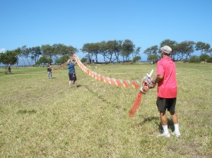 Robert Loera and volunteers setup a giant, 175-foot-long Chinese dragon kite for flight at Lahaina’s Kite Festival flying day. Photo courtesy of Lahaina Restoration Foundation