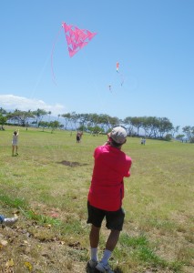 Robert Loera flies large tetrahedral kite made by Lahaina’s Kite Festival participants during last year’s event while participants fly their own kites on kite flying day. Photo courtesy of Lahaina Restoration Foundation