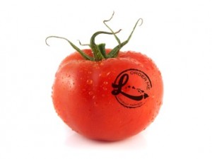Tomato with Localicious Hawai'i logo. Photo courtesy of Hawai‘i Agricultural Foundation.