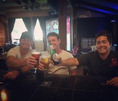 The three friends behind Three's celebrate in their restaurant. Courtesy photo.