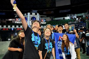 A jubilant Baldwin robotics team take a group selfie after snagging the regional title at the 2016 Hawaii FIRST Regional Competition.