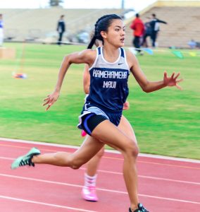 Kamehameha Maui's Ani Nitta en route to winning the girls 100 and 200 Friday at the Yamamoto Track & Field Facility. Photo by Rodney S. Yap.