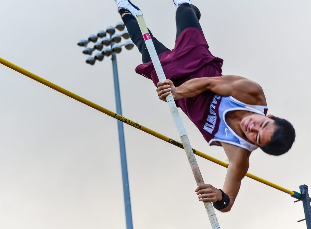 Baldwin's Sean Fukuhara goes over the pole vault crossbar at 14 feet last week at MIL Meet #4. He is the state's top-ranked vaulter at 14-7. Photo by Rodney S. Yap.