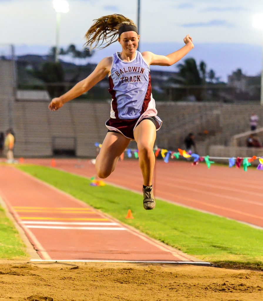 Baldwin's Kaitlin Smith en route to one of two meet records she set in Friday's trials of the MIL track and field championships. Photo by Rodney S. Yap.