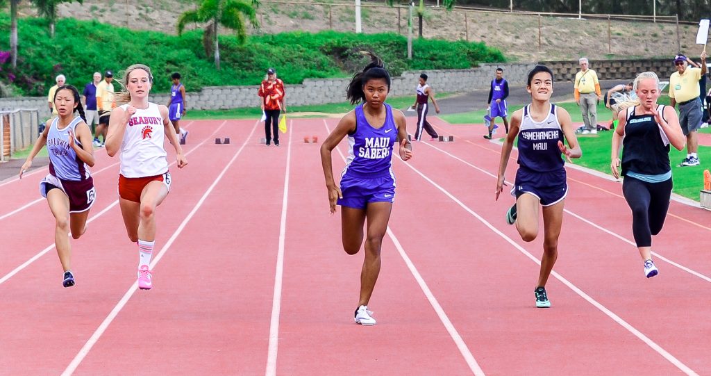 Maui High freshman Alyssa Mae Antolin runs to a first-place finish in the girls 100-meter dash Saturday. Photo by Rodney S. Yap.
