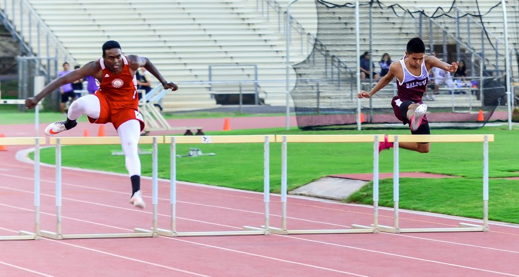 Baldwin's Kiernan Leighton Mateo (right) won Saturday's 300-meter hurdles battle with Lahainaluna's Kamal Golaube. Mateo returned to the track after a five-week layoff. Photo by Rodney S. Yap.