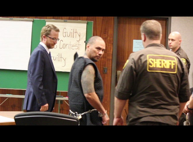 Defendant Stephen Schmidt glances back as he is escorted out of the courtroom following Wednesday's preliminary hearing.