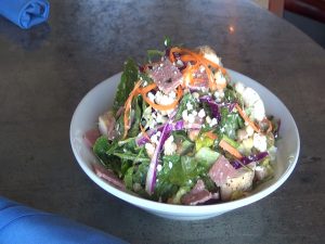 The fully-loaded "Plack Salad" on Manoli's menu. Photo by Kiaora Bohlool.