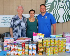 Upcountry Rotarians Harlan Hughes (from left), Carly Heims, and Club President Zak Pacholl collect donations at Foodland in Pukalani for the Maui Food Bank.