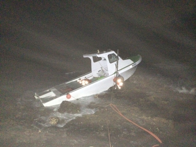 Grounded vessel at "Little Beach" in the South Maui area of Mākena. Photo credit: DLNR.