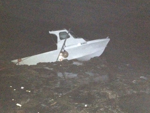 Grounded vessel at "Little Beach" in the South Maui area of Mākena. Photo credit: DLNR.