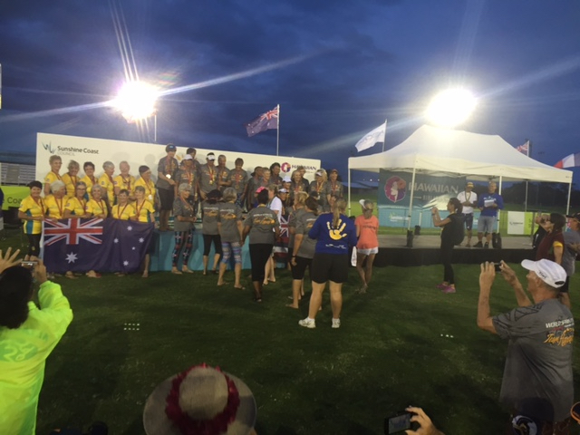 Hawaiʻi 70-and- older women paddlers accept gold and silver medals on the Kawana Sports Stadium podium amidst hoopla and flashing cameras Tuesday at the 2016 International Vaʻa Federation World Sprints being staged this week in Queensland, Australia. Photo by Jeremy Jameson.