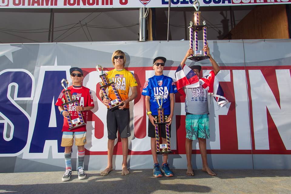 Ocean hoisting his 1st Place trophy in honor of the Hawaiian State. Photo: USA Surfing