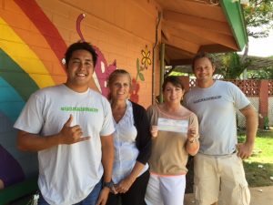 Travis Morrin and Jaron Blosser of Three's Bar & Grill present a donation check to Maui Humane Society. Courtesy photo.